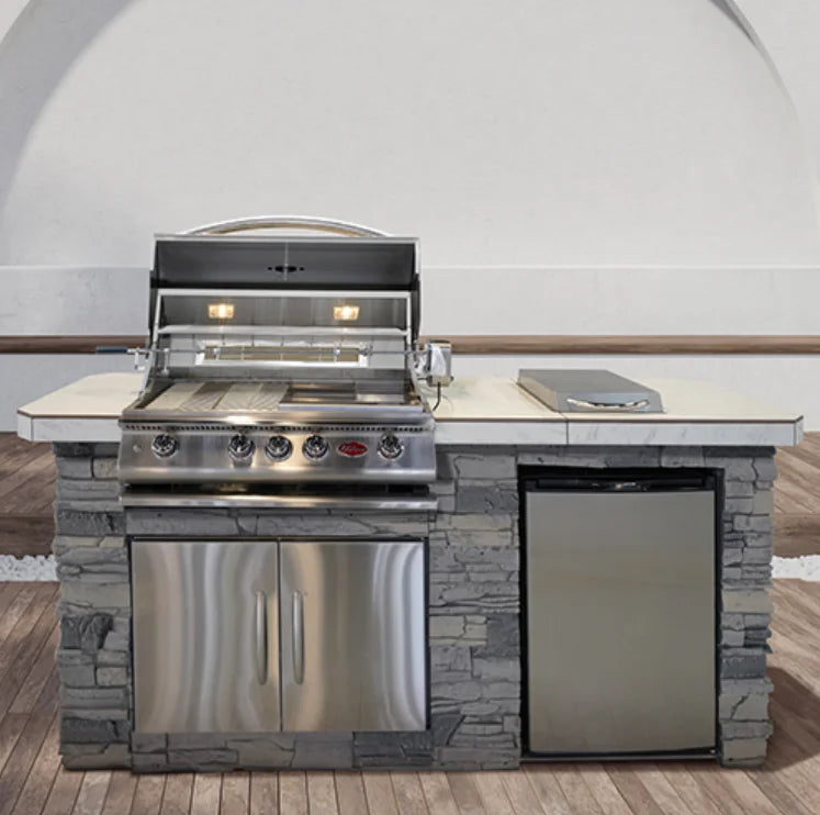 Cal Flame 'Pacifica' BBQ Island features a compact linear design with high-performance 4 Burner G4 LP Grill, porcelain tile countertop, and optional refrigerator and side burners.