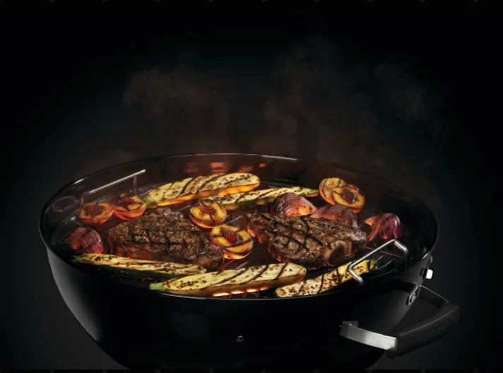 Napoleon Premium 18 Charcoal Kettle Grill features an 18-inch diameter stainless steel cooking grid, Vortex heat management system, and adjustable air vents for precise temperature control and optimal heat circulation.