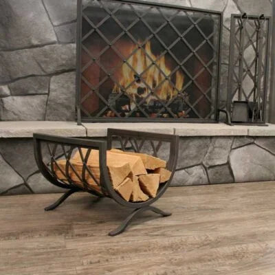 Pilgrim Iron Weave Log Holder - A beautifully crafted hand-forged iron frame in distressed bronze finish, featuring an intricate weave design for storage and a sculptural touch to your fireplace.