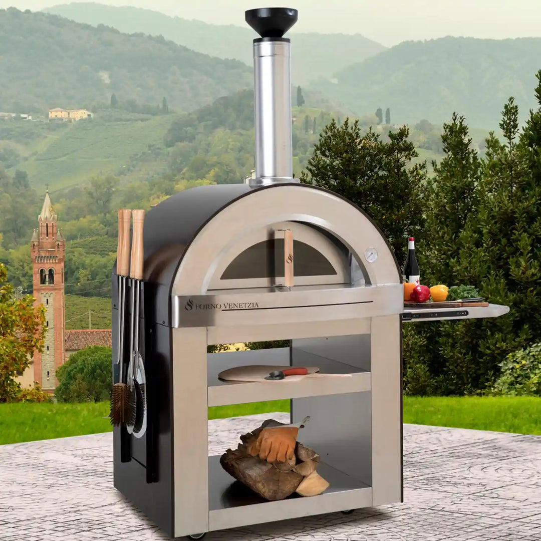 Forno Venetzia Torino 500 Copper - Elegant copper dome outdoor pizza oven with handcrafted Italian engineering, featuring a 32" × 24" cooking surface, firebrick hearth, and stainless steel cart with pull-out shelf.