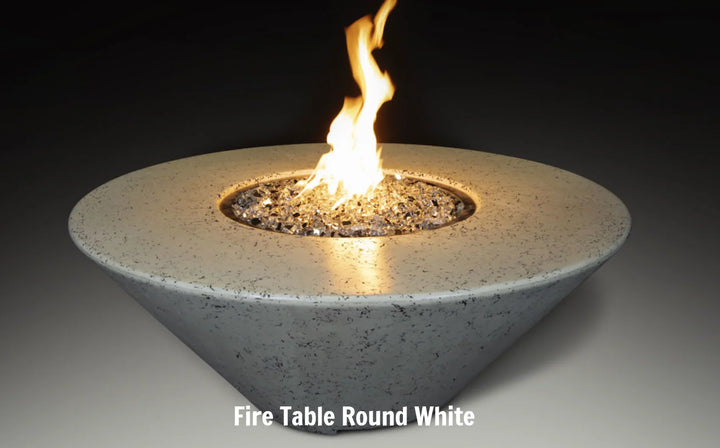 Grand Canyon Olympus Round Fire Table: Modern American-made fire table featuring a sleek, angled design with generous tabletop space for food, drinks, or décor, radiating warmth and ambiance.