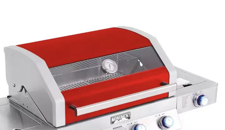 Monument Grills Red Classic Series 4-Burner Gas Grill featuring stainless steel construction, infrared side sear burner, extra side burner, ClearView glass lid, and LED-backlit control knobs.