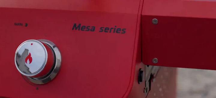 Monument Grills 'M200S' Red Gas Grill - Mesa Series: Compact, 2-burner propane grill with red powder-coated finish, porcelain-coated cast iron grates, and 30,000 BTUs of cooking power.
