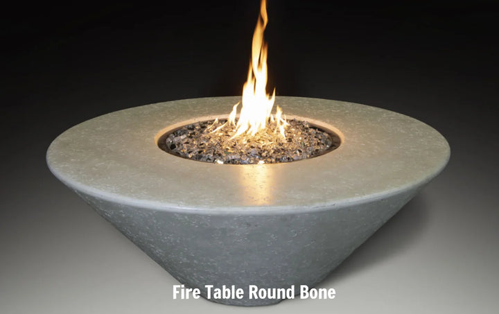 Grand Canyon Olympus Round Fire Table, contemporary design with angled profile and spacious tabletop, featuring innovative flame effect and sleek GFRC construction.