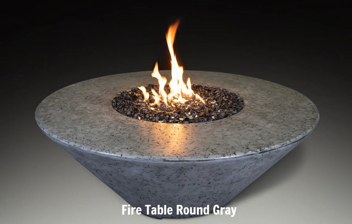 Grand Canyon - Olympus Round Fire Table: A modern, GFRC crafted fire table with angled sides and generous tabletop surface, perfect for warm ambiance and outdoor entertaining in any season.