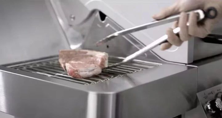 Monument Grills Classic Series 35633 Stainless Steel 4-Burner Gas Grill features four stainless steel burners, side sear station, clear-view glass lid, and LED backlit control knobs for professional-quality grilling with up to 72,000 BTUs of power.