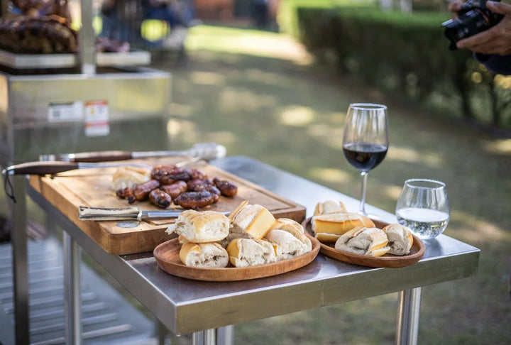 Tagwood Working Table - Stainless Steel: Durable premium 304 stainless steel construction, mobile design with heavy-duty casters, and ample 835 sq. in. prep area for outdoor kitchens or grilling setups.