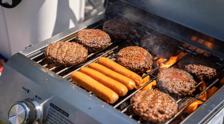 Monument Grills Classic Series 2-Burner Tabletop Gas Grill features premium stainless steel construction, dual burners delivering 15,000 BTUs, and compact design ideal for patios, camping trips, or tailgates.