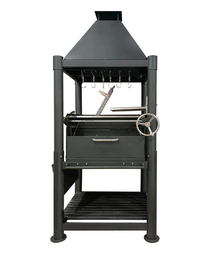 Tagwood "The Beast" Santa Maria Style Grill - Black: A bold, all-black Argentine firewood and charcoal grill featuring six distinct cooking surfaces, including dual adjustable grates, clamp grill, swivel grate, griddle, warming rack, and S-shaped meat hooks, with premium 304 stainless steel construction for safe performance.