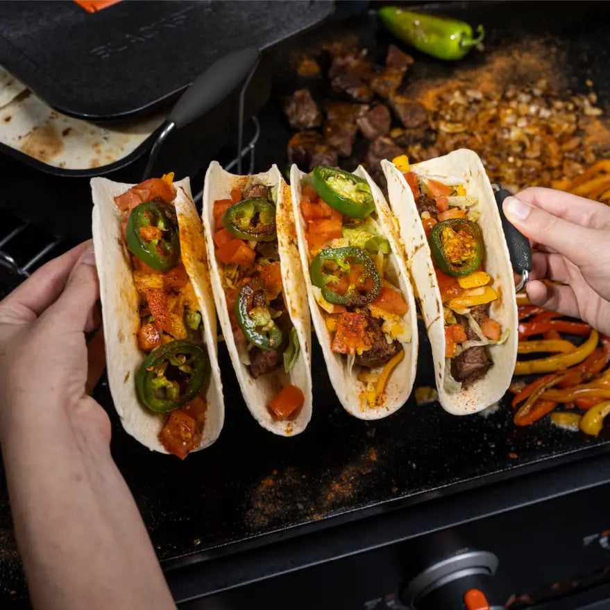 Blackstone Taco Kit: Complete taco serving set includes tortilla warmer trivet, warmer, toppings tray, and wire racks for effortless assembly and cleanup.