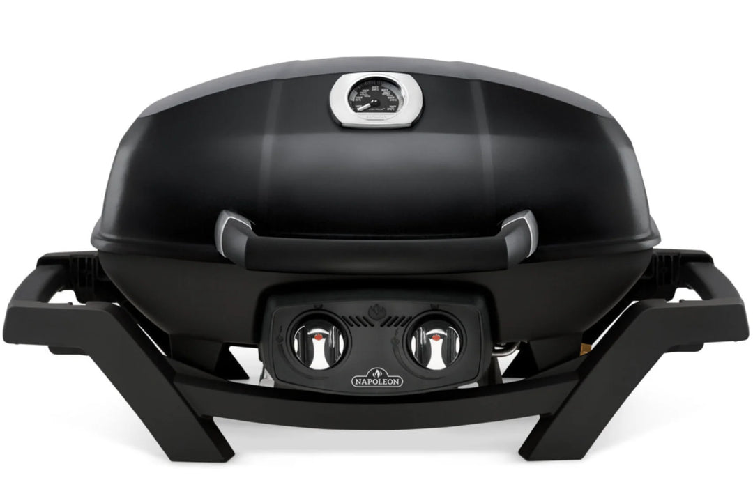 Napoleon TravelQ Pro285 portable gas grill features sleek all-black design, high-topped cast aluminum lid, dual stainless steel burners, and porcelainized cast iron WAVE grids for precise temperature control and gourmet-style cooking results.