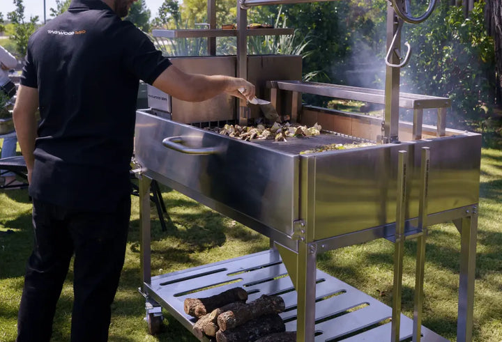 Tagwood BBQ Stainless Steel Warming Rack: a height-adjustable accessory for keeping food warm, toasting bread, and resting meats while grilling.