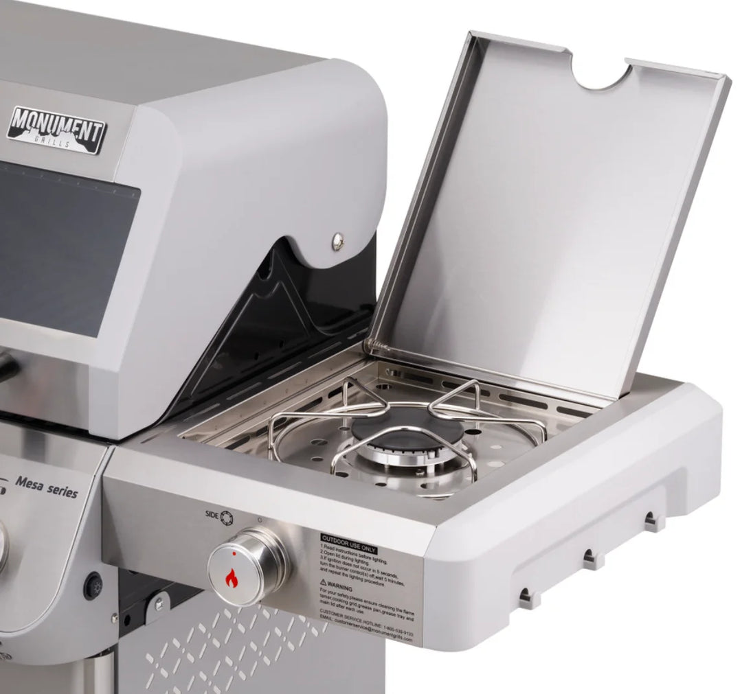 Monument Grills Mesa Series M415BZ Gas Grill - A high-performance stainless steel propane grill with 4 burners, ClearView lid, infrared burner, side burner, and large cooking area for precise grilling results in style.
