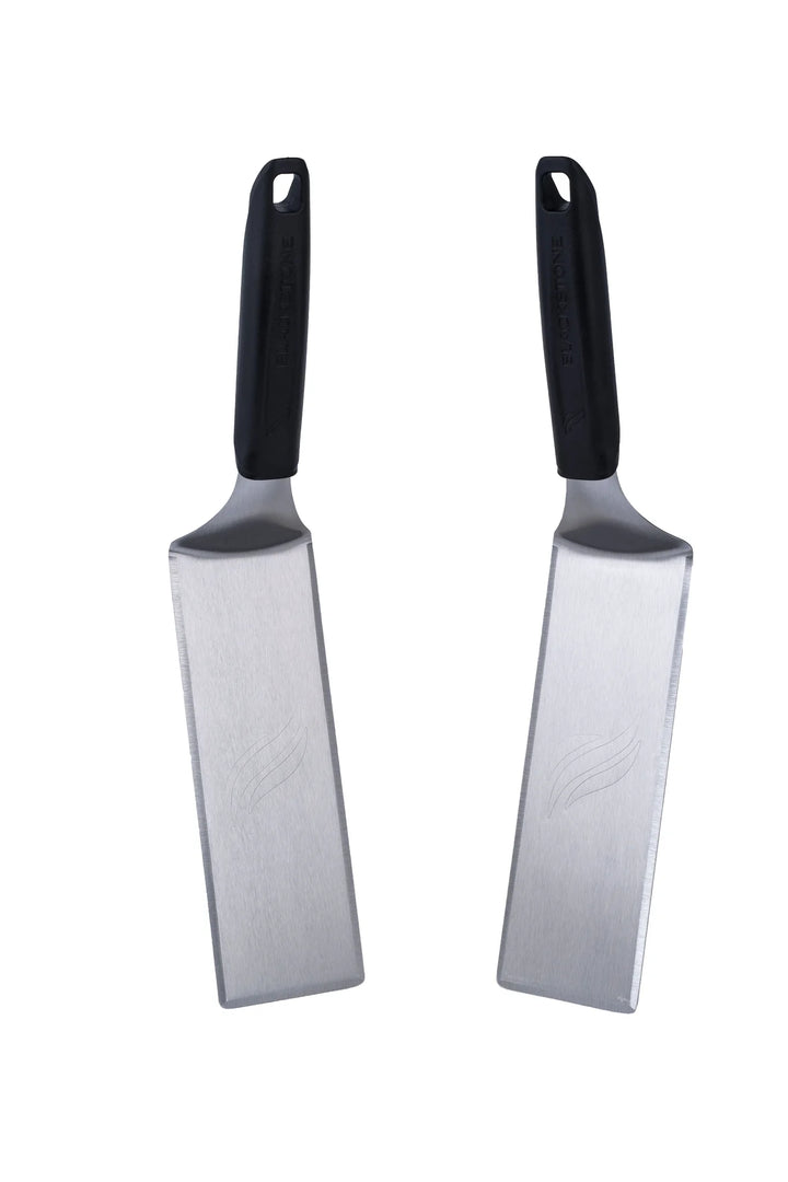 Blackstone Deluxe Spatula Set - Two heavy-duty stainless-steel spatulas with beveled edges for chopping, scraping, and flipping food with precision, featuring heat-resistant handles and hanging loops for easy storage.