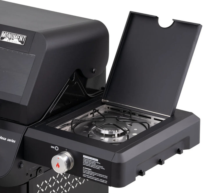 Monument Grills Mesa Series M325 compact 3-burner propane gas grill with black powder-coated steel exterior, porcelain-coated cast iron grates and individual burner knobs for precise temperature control.