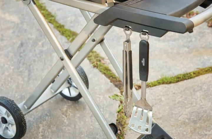 Napoleon TravelQ PRO 285X Portable Propane Gas Grill and Scissor Cart featuring 285 sq in cooking space, dual stainless steel burners, high-topped cast aluminum lid, and iconic WAVE cast iron cooking grids.
