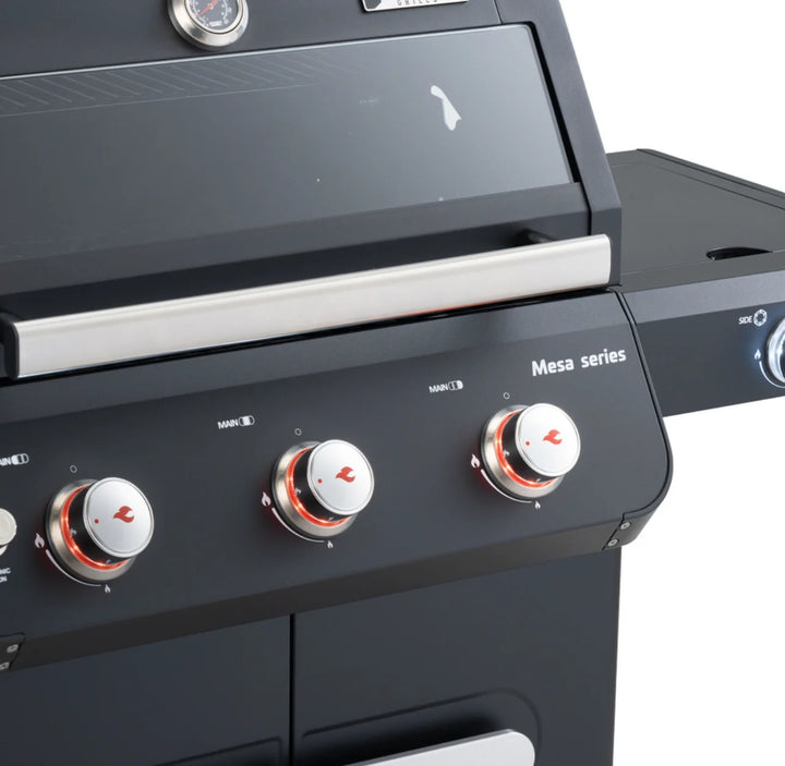 Monument Grills Mesa Series M325 3-Burner Gas Grill featuring black powder-coated steel construction, porcelain-coated cast iron grates, and precise temperature control for effortless grilling.