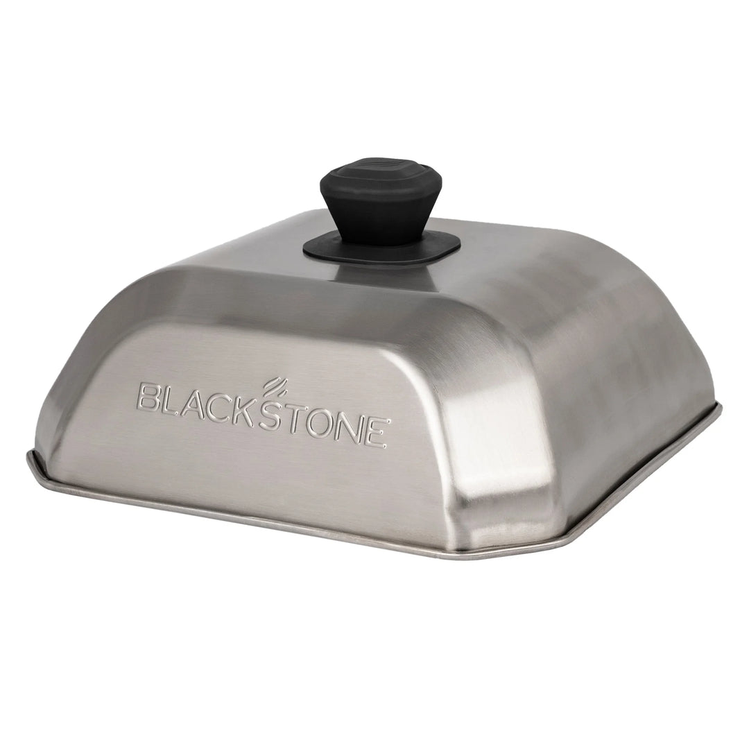 Blackstone Medium Square Basting Cover: A durable metal dome designed to trap heat and moisture for optimal cooking performance, perfect for griddle steaming, melting cheese, or cooking vegetables in a 10" x 10" square shape.